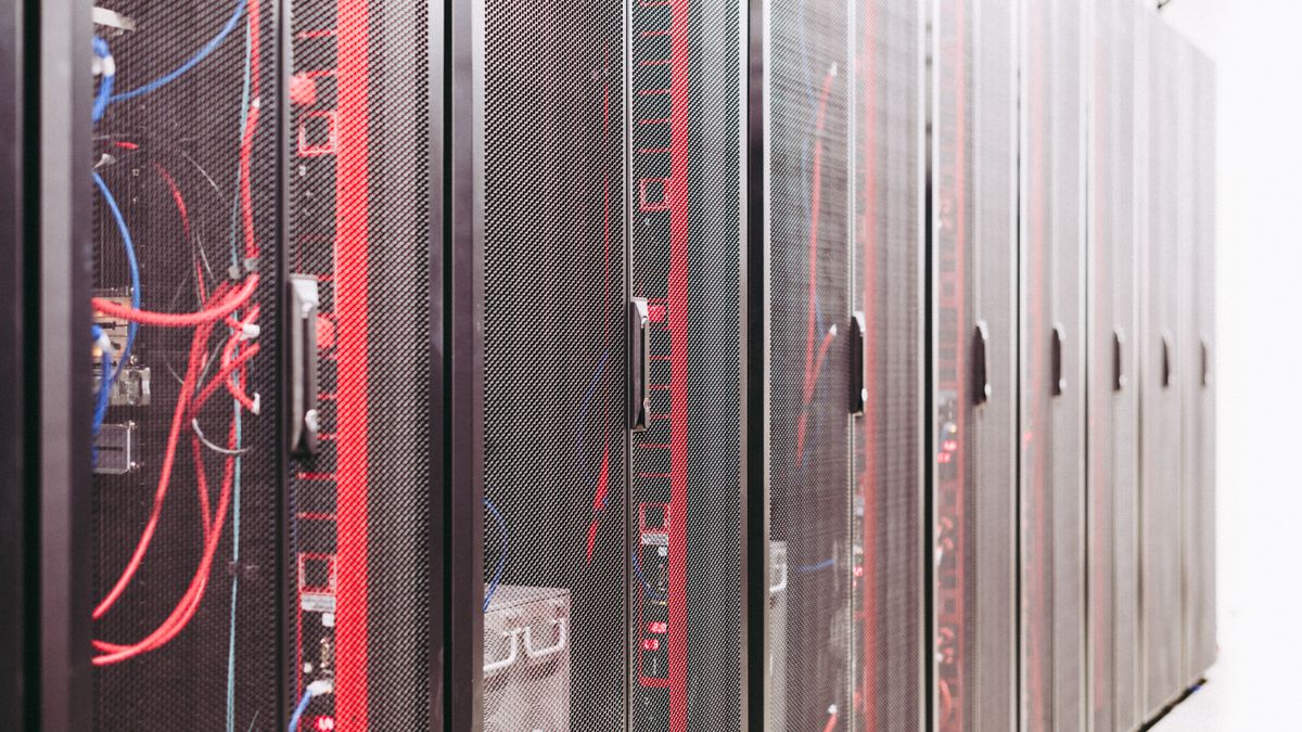 A corridor of server racks in an enterprise data center