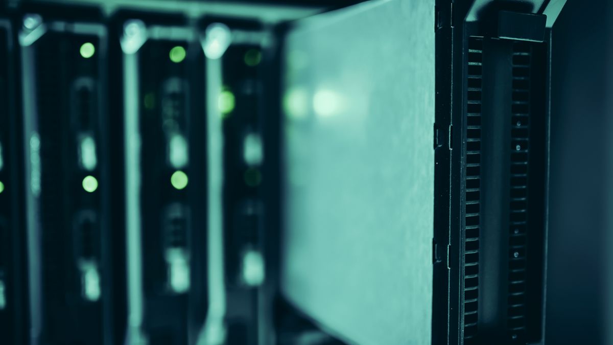 A long corridor of server racks in an enterprise data centre